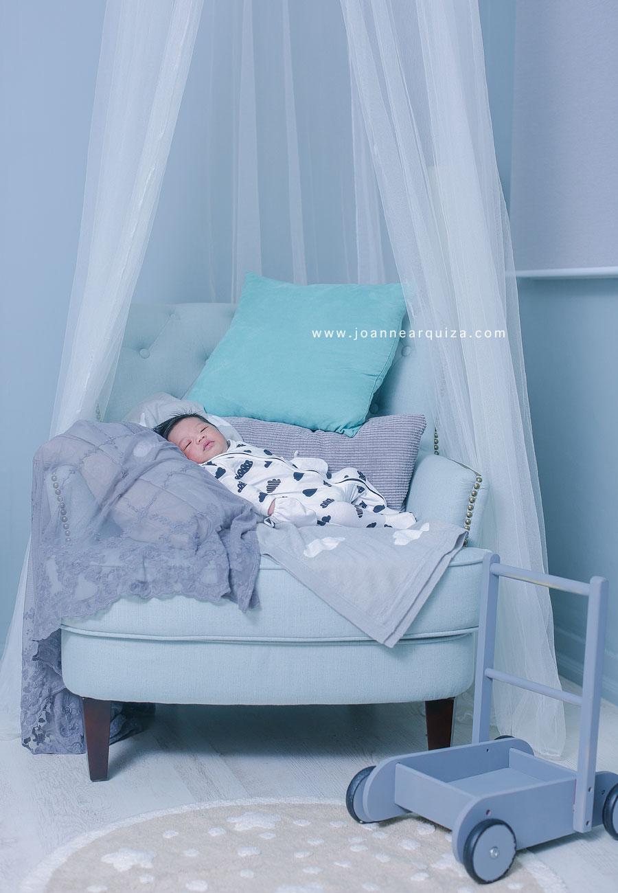 Newborn portraits photoshoot with a sleek and clean styling photographed by Joanne Arquiza.